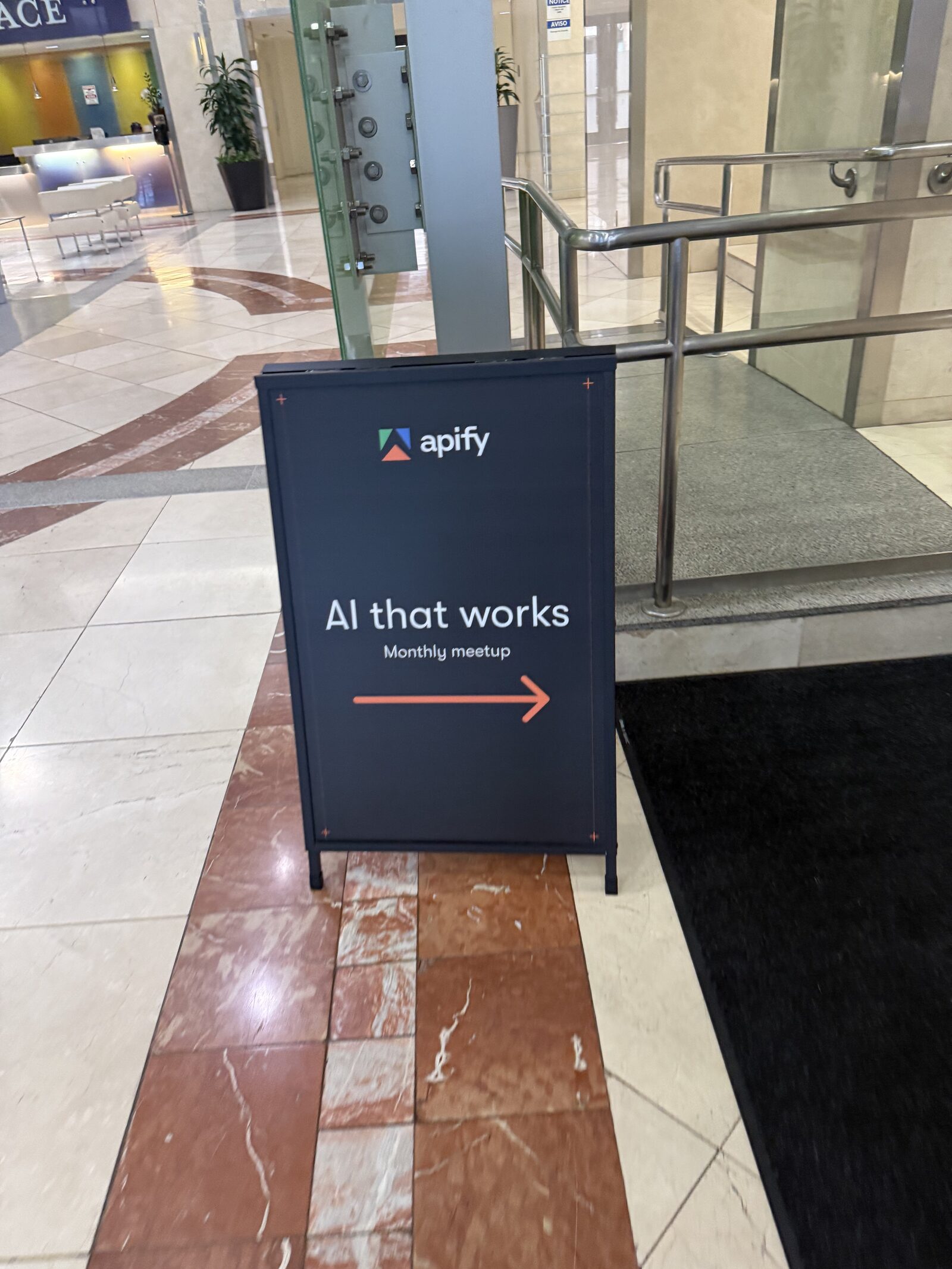 Apify "AI That Works" A-frame sign in the Antler VC lobby