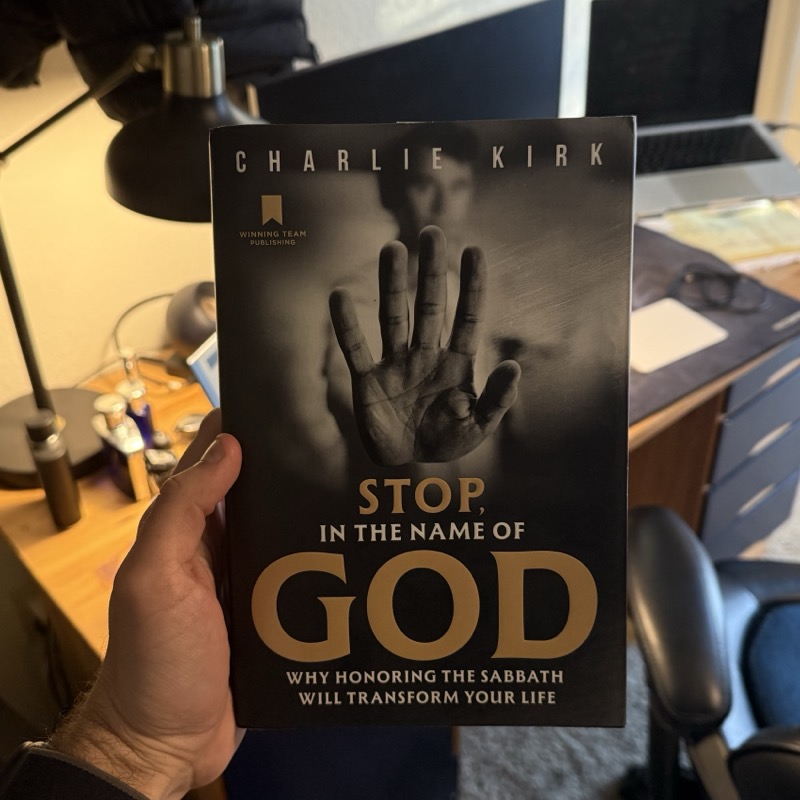 Stop, in the Name of God by Charlie Kirk — hardcover book at reading desk